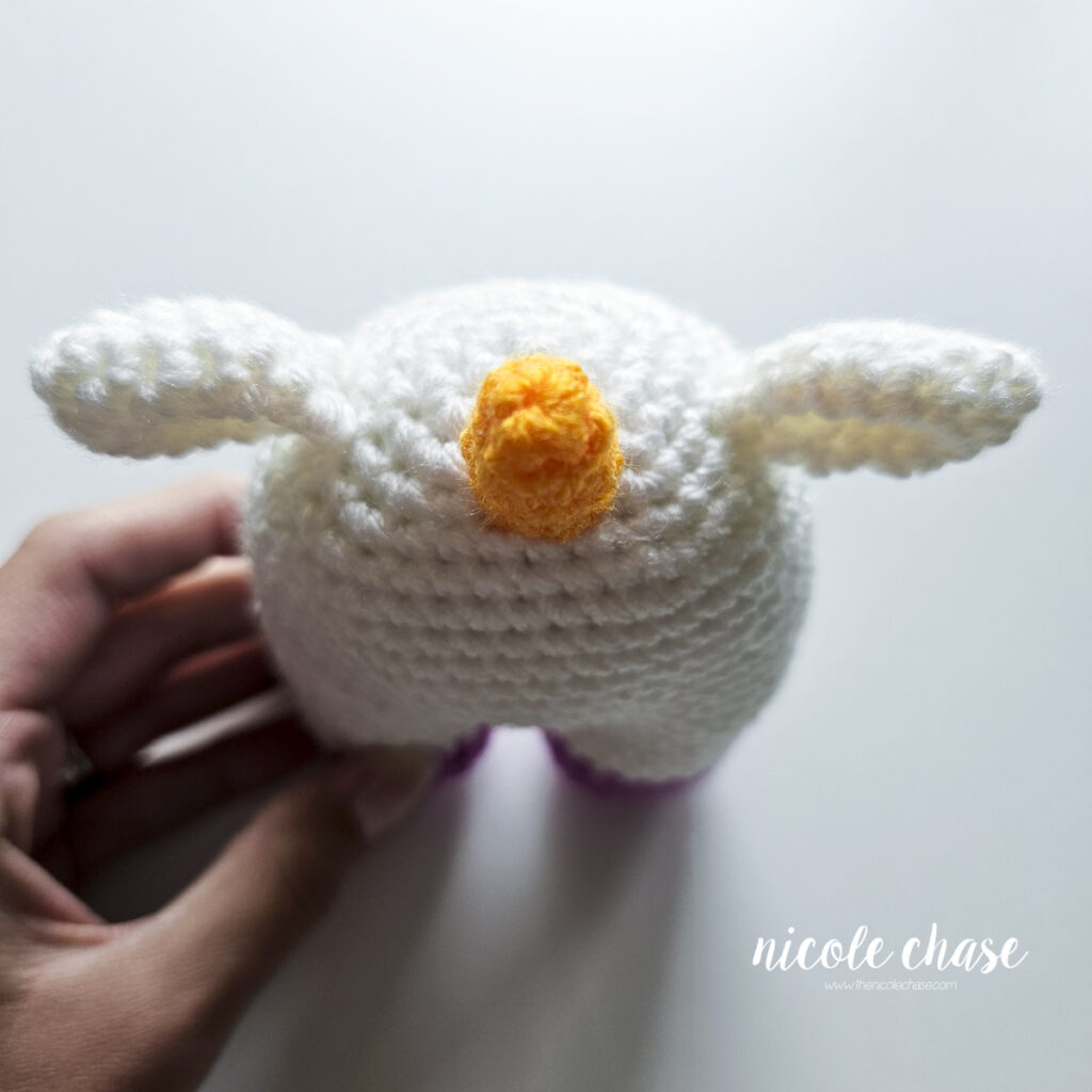 A top down view of the unicorn horn that has been sewn into place on the top of the head.