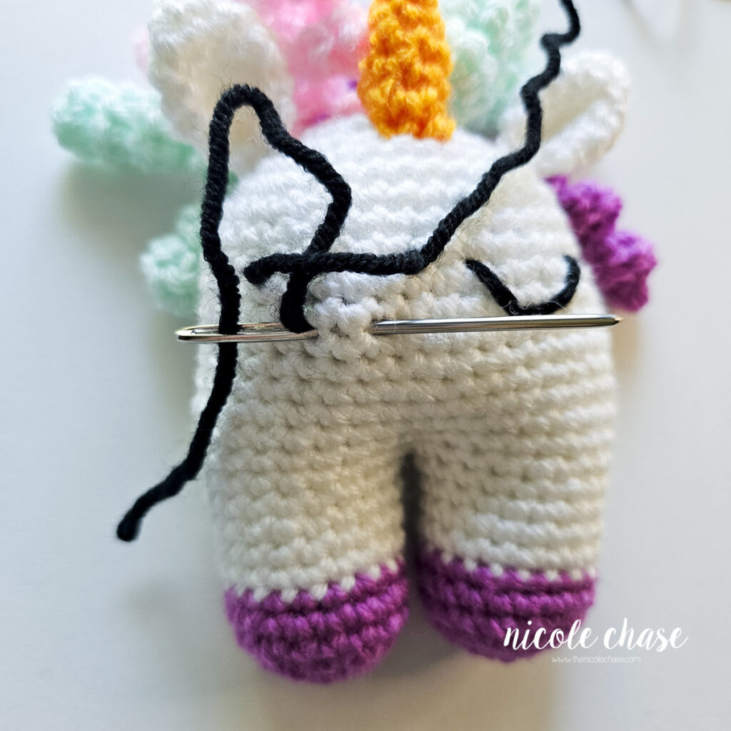 The yarn is looping over the straight line, securing the dip.