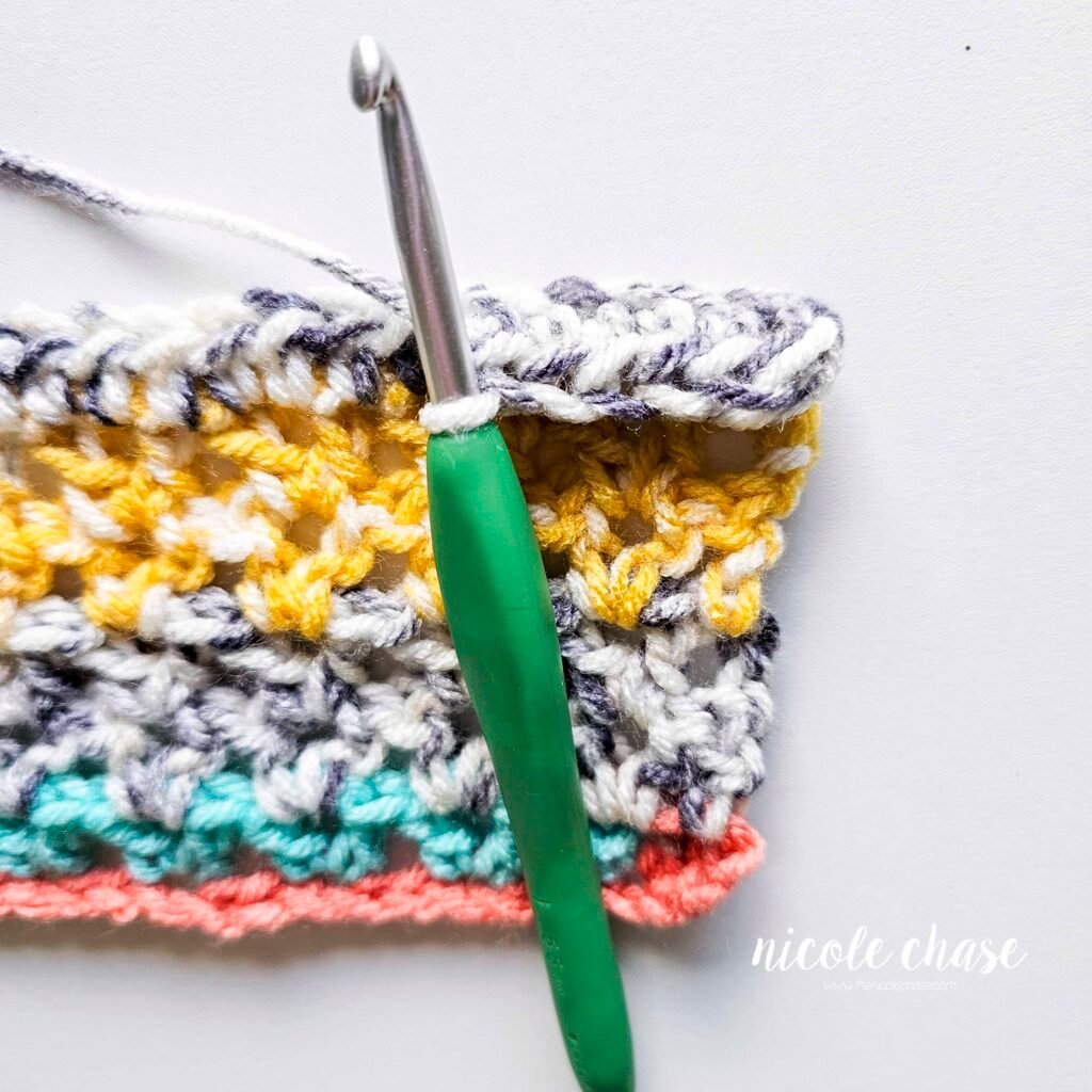Working R7 of the New Beginnings Cowl crochet pattern, part 5.