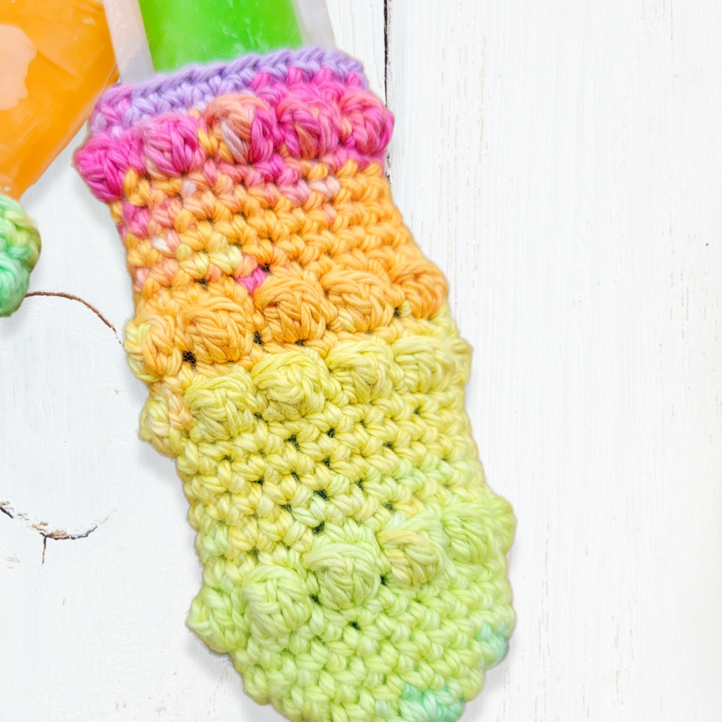 free crochet freeze pop holder pattern bobble stitches in various bright colors
