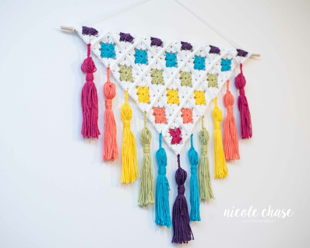granny square wall hanging in rainbow colors