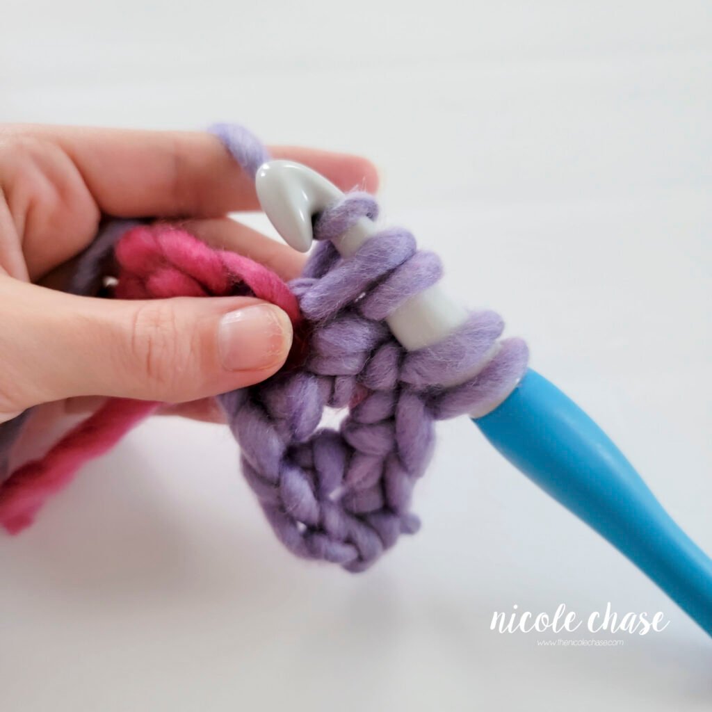 Crochet bobble stitch step 2c: demonstrating the second partial double crochet into the same stitch.