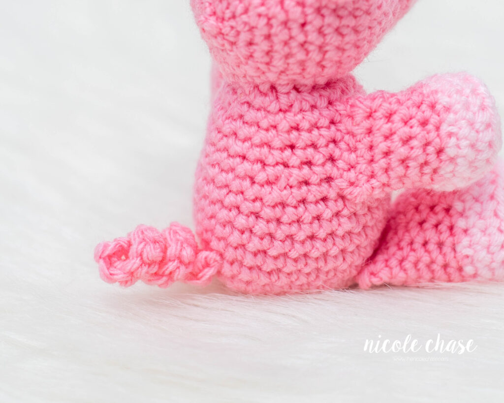close up view of the curled tail on the pig crochet pattern