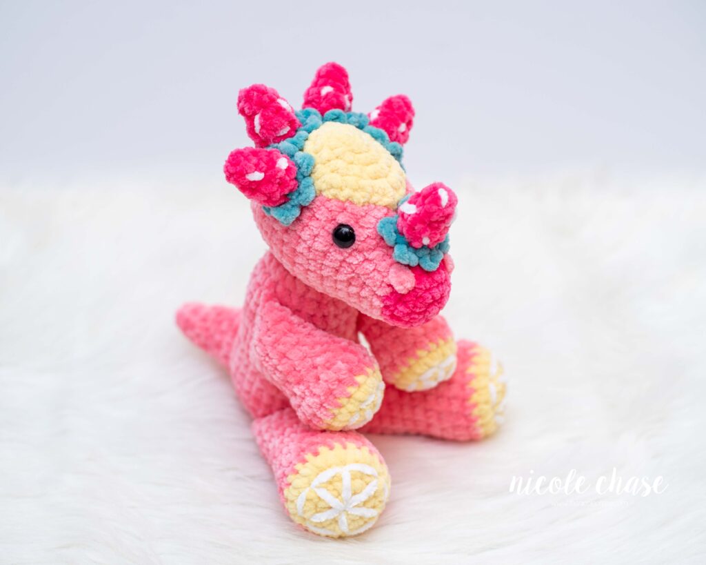 strawberry lemonade stygimoloch shown in pink with strawberry and lemon accents
