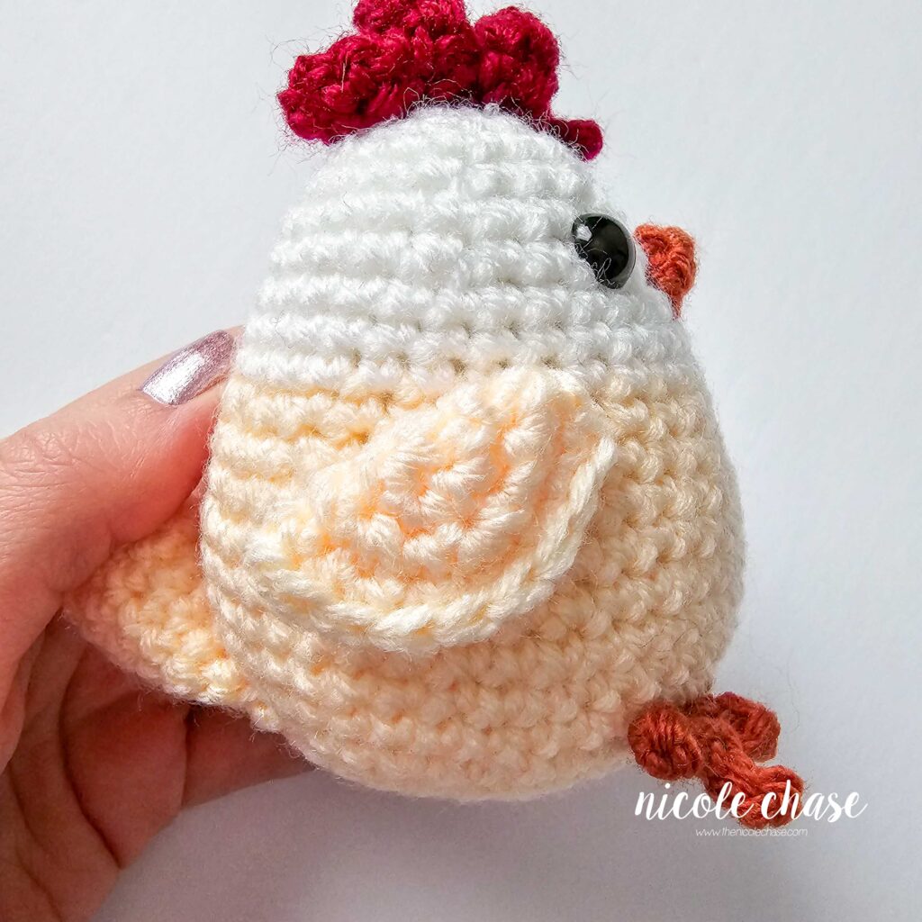 wings attached to the side of the crochet chicken
