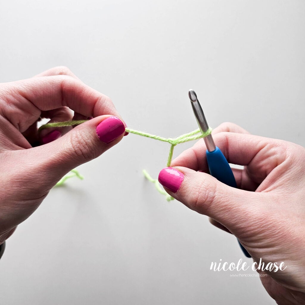 Pull both strands of yarn away from each other to tighten the slip knot against your hook.