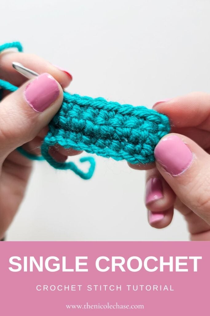Master the basics with this single crochet tutorial! This pin image shows a close up of hands holding a swatch of single crochet stitches worked in rows, with a pink banner that reads: Single Crochet, Crochet Stitch Tutorial, and the web address.