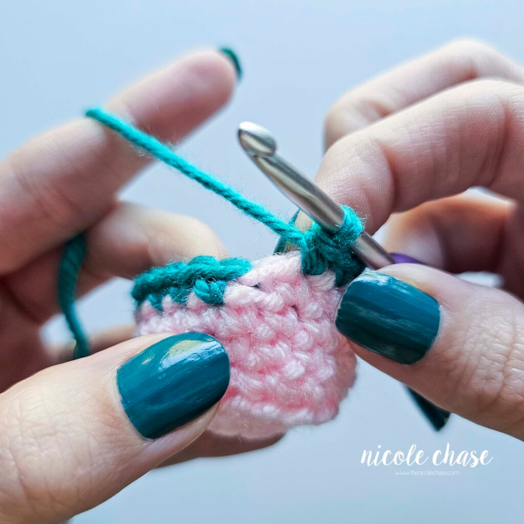 Continue crocheting the new color for the amigurumi invisible color change until you reach the stitch where the color change started.