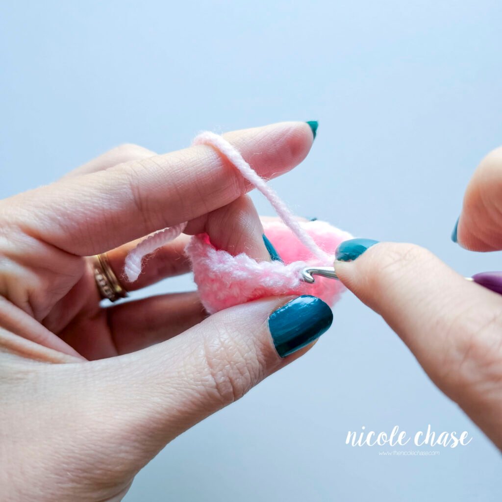 Insert your hook into the back loop of the next stitch to begin the invisible color change for amigurumi, part 1.