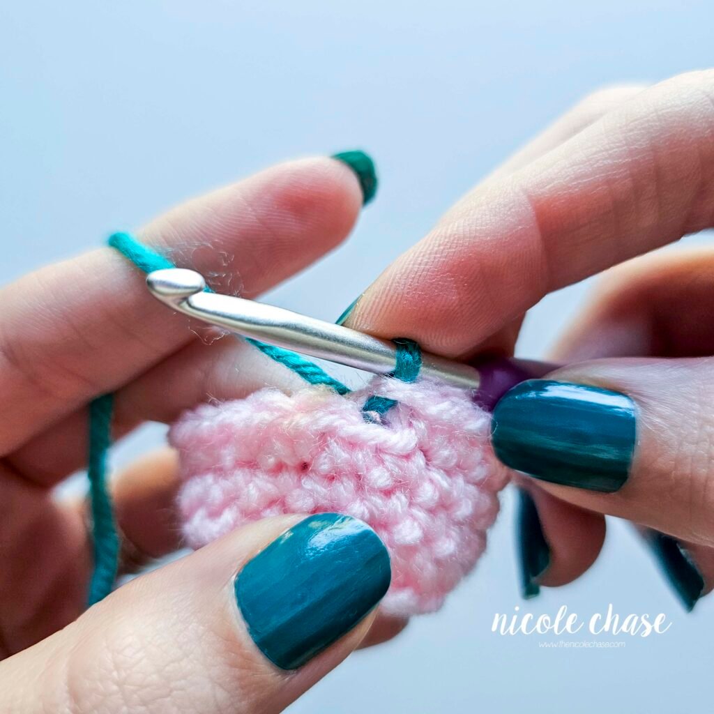 Photo illustrating the new color being on the crochet hook for the invisible color change.