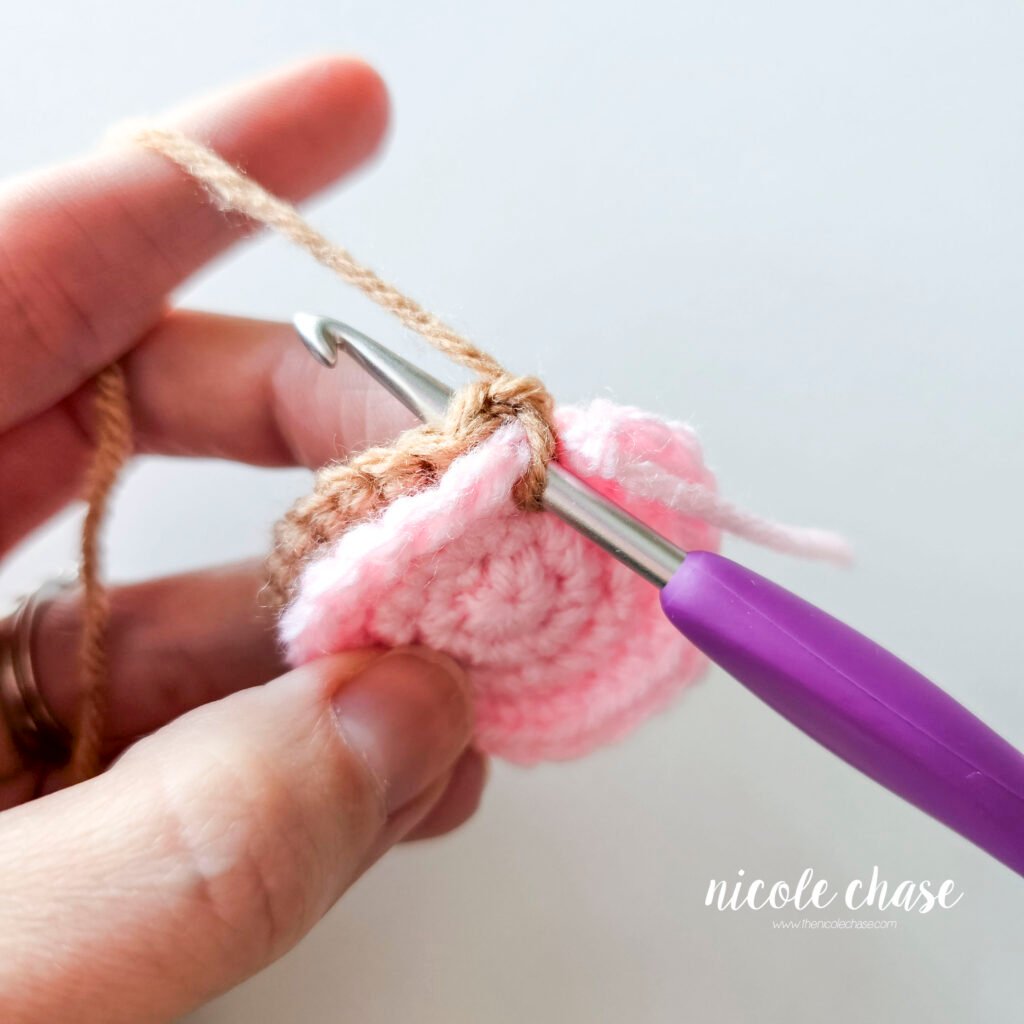 Joining the inner ear and outer ear together for the amigurumi mouse crochet pattern, step 5.