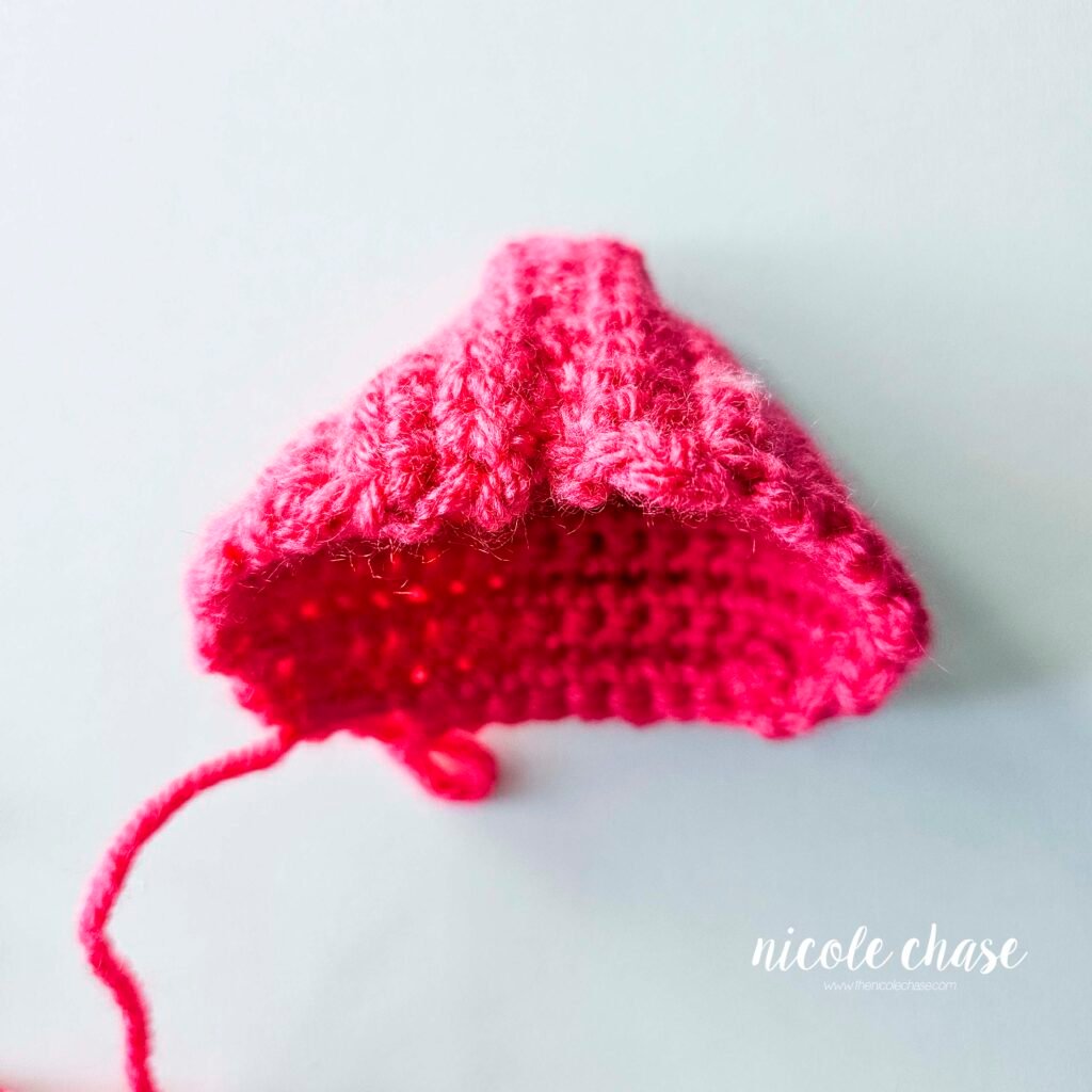 The crochet hood for the mouse's sweatshirt after being flipped so that the seam is on the inside. 