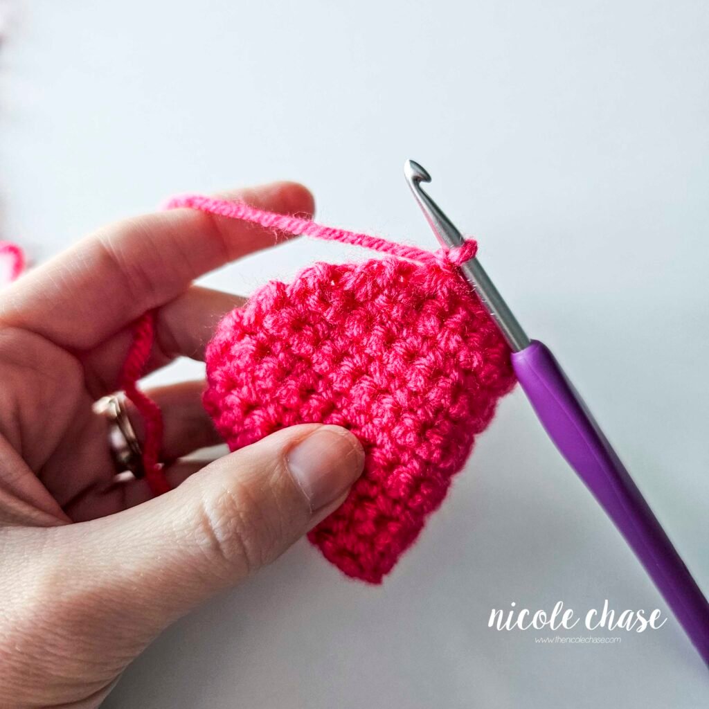 The crochet hood for the mouse's sweatshirt showing the start of crocheting around the edge of the hood. 