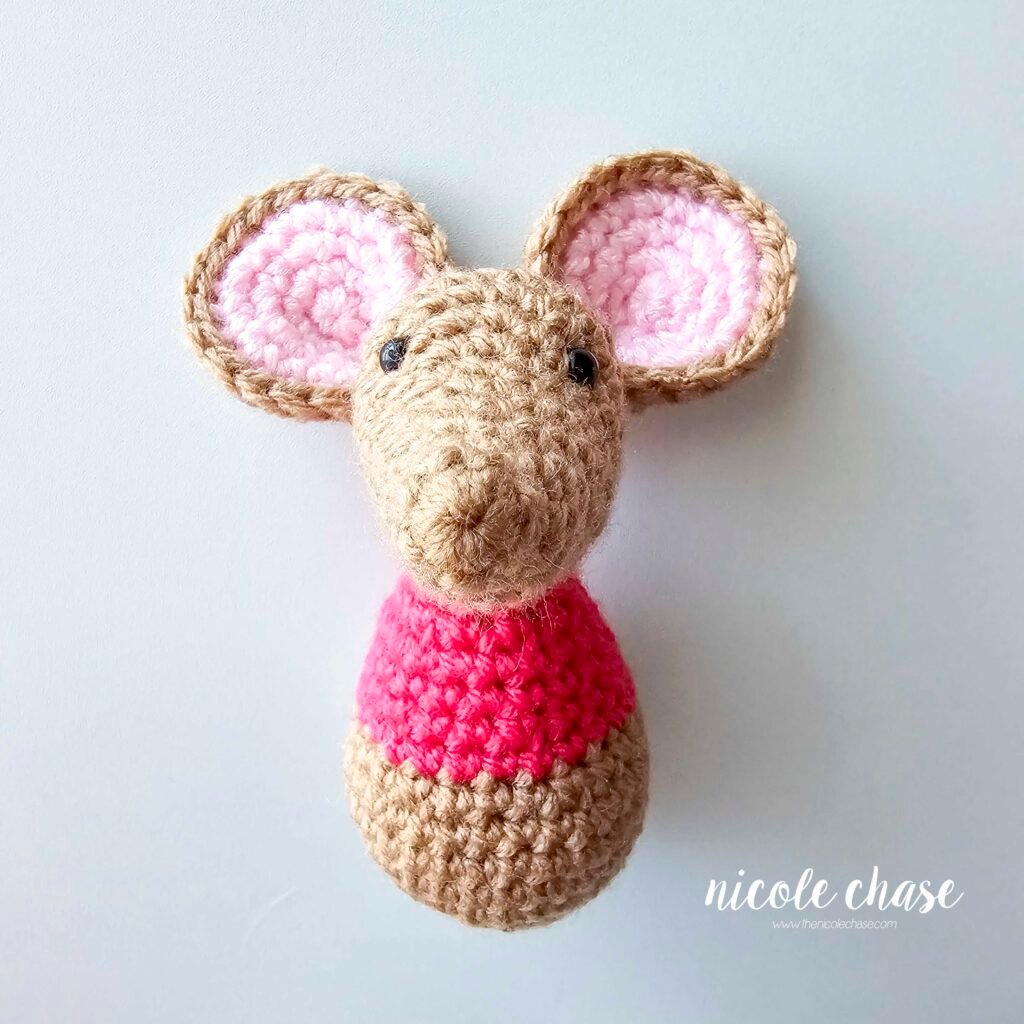 The ears of the free mouse crochet pattern for Mavis has been sewn into place, view 1.