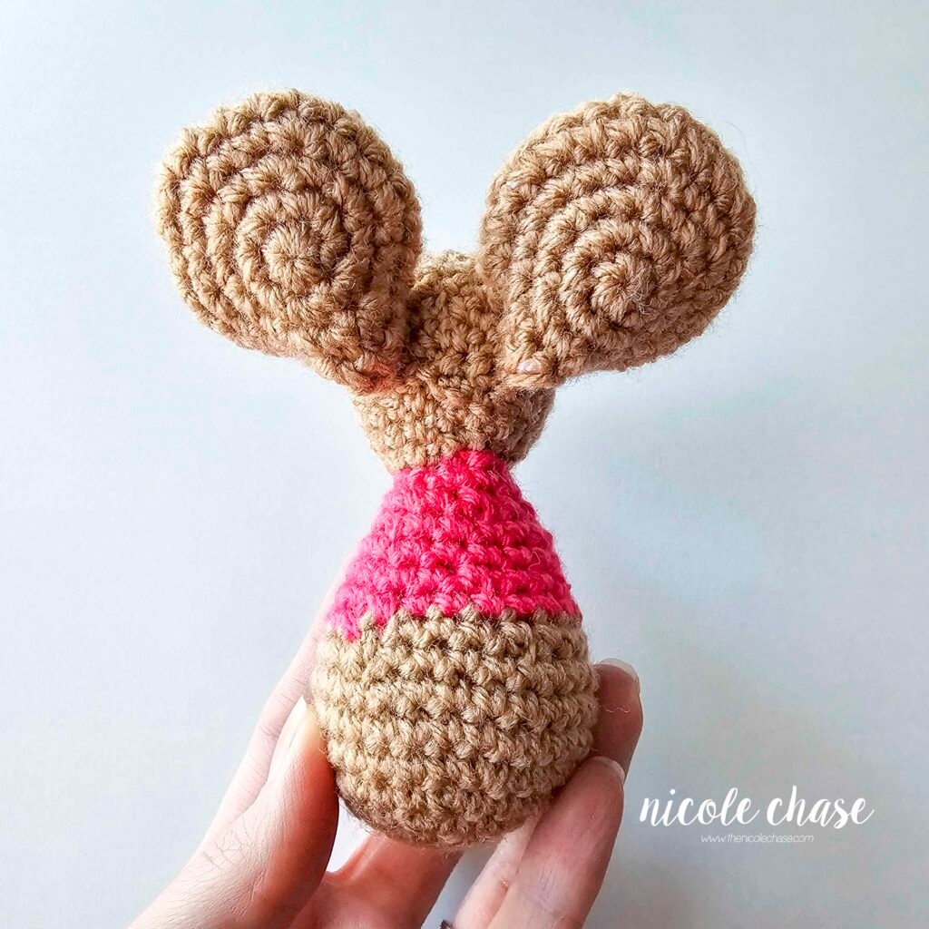 The ears of the free mouse crochet pattern for Mavis has been sewn into place, view 3.