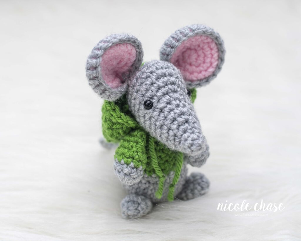 free mouse crochet pattern shown with a gray mouse wearing a green sweatshirt