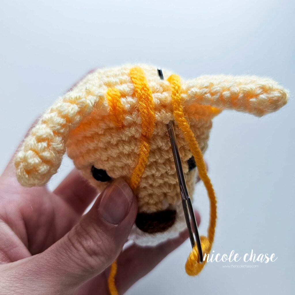 Embroidering the third stripe on the cat crochet pattern, step 1. 