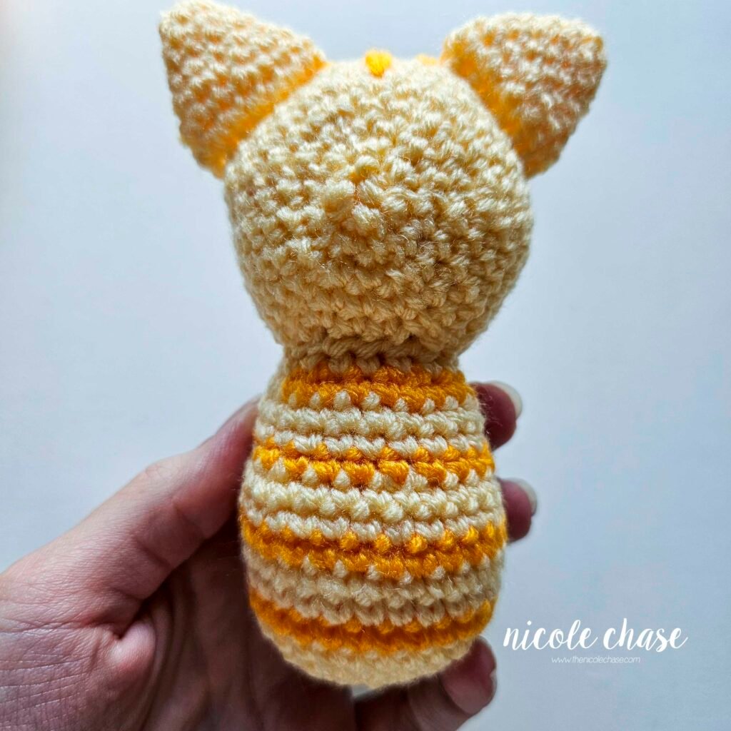 Backside view of the cat's head sewn in place. 