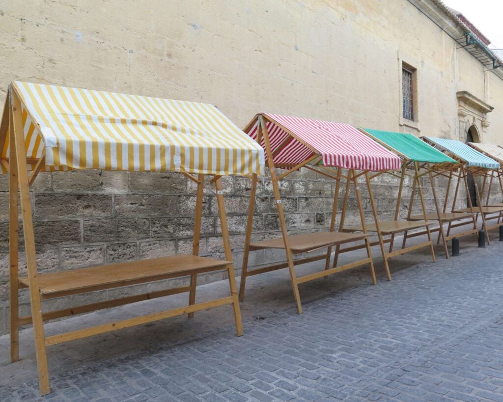 A photo of various vendor displays at a pop-up shop event. 
