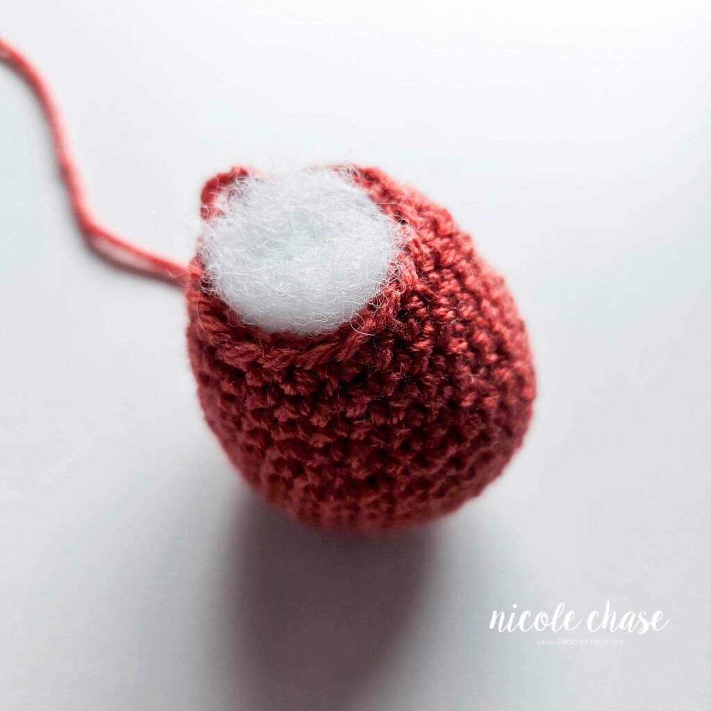 Finished crochet body piece for Mini Archie, filled with stuffing.