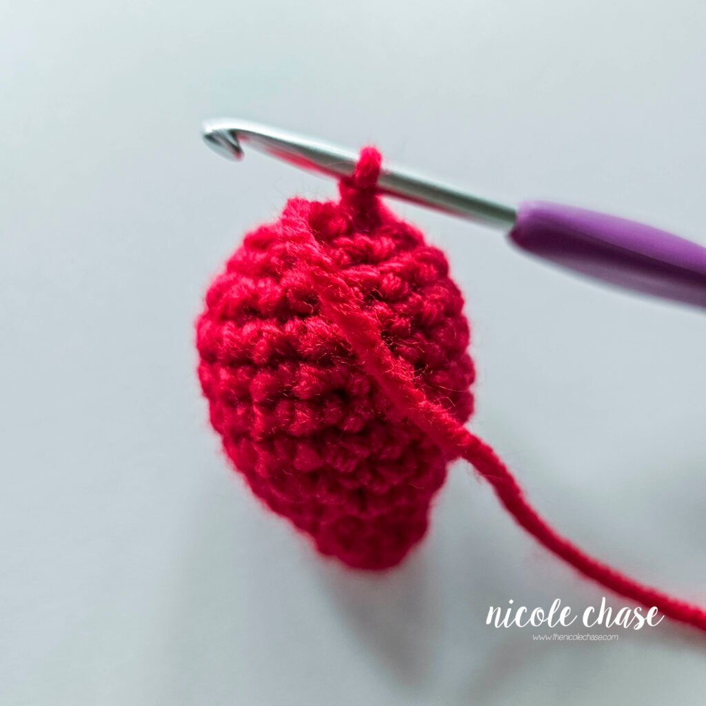 Close-up of the bulb portion of the crochet Christmas light bulb. 