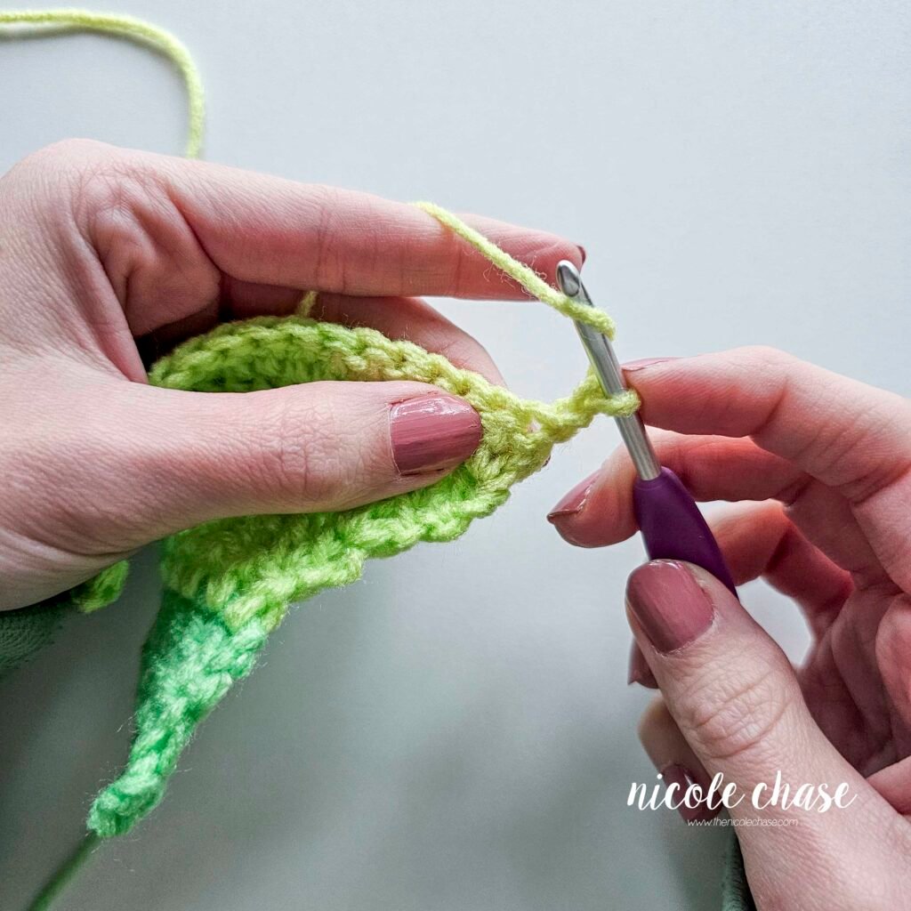 Working a double crochet decrease stitch, step 1.