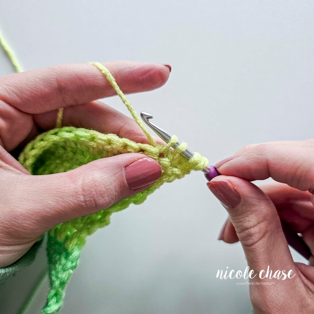 Working a double crochet decrease stitch, step 10.