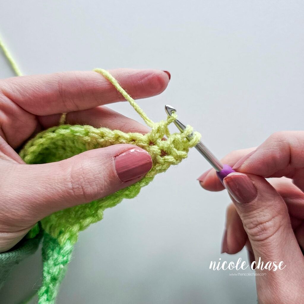 Working a double crochet decrease stitch, step 12.