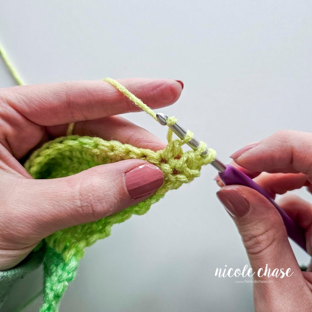 Working a double crochet decrease stitch, step 13.