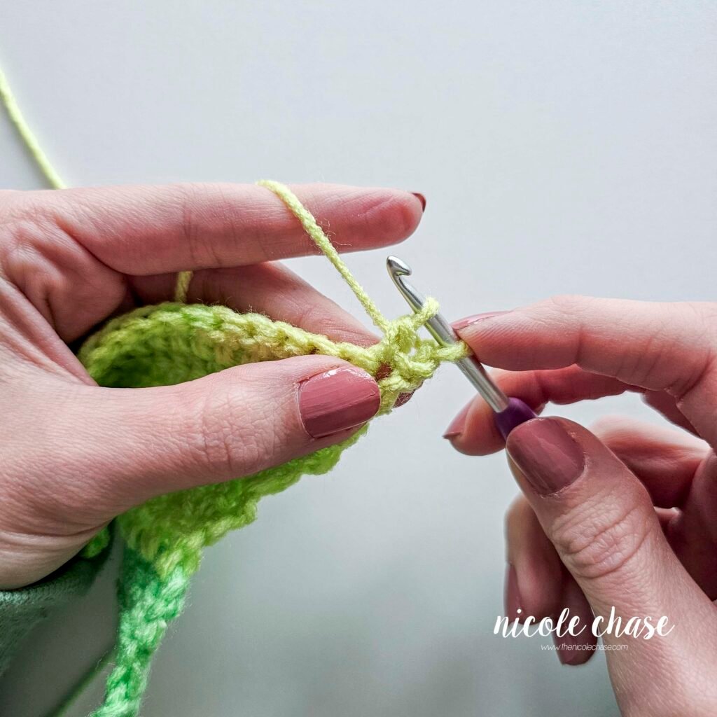 Working a double crochet decrease stitch, step 6.