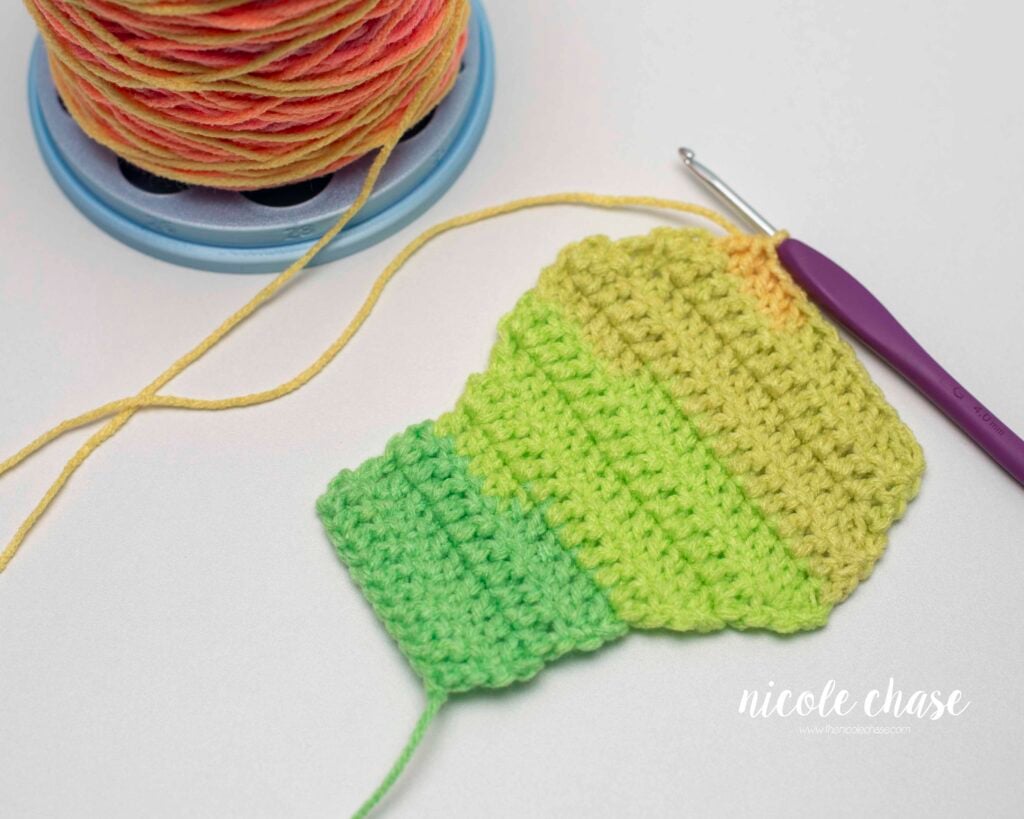 Crochet swatch for the double crochet increase and decrease tutorial. Showing rows of the double crochet increase and rows using the dc2tog.