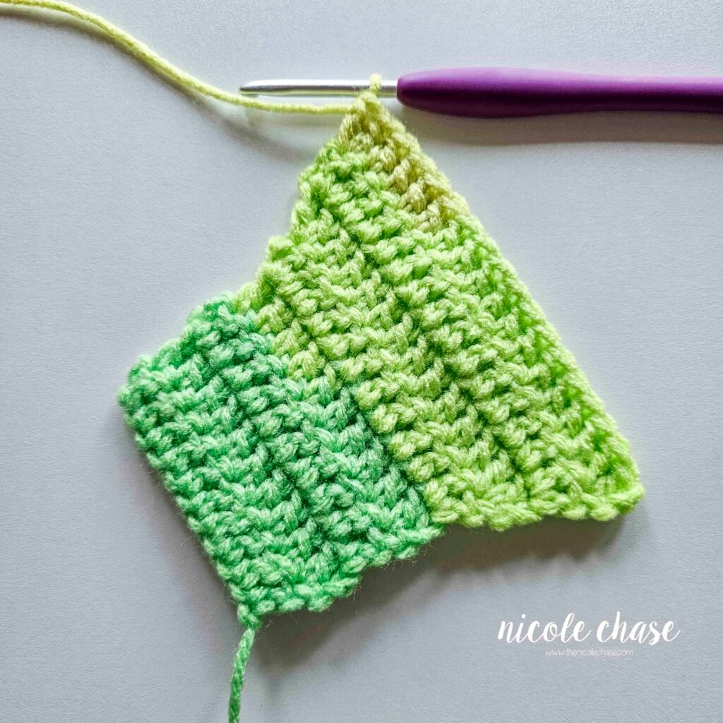 Swatch of double crochet stitches after a few rows of adding a dc increase on the start and end of each row.