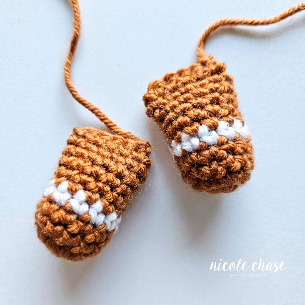 Two crochet gingerbread man arms for Gerry the Gingerbread. 