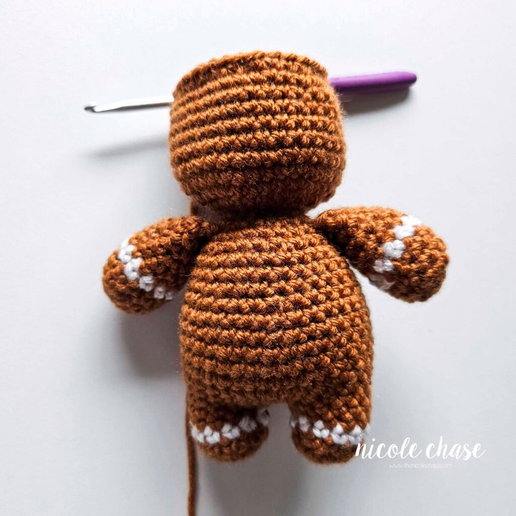 Showing the head after R33 of the free crochet gingerbread man pattern, before adding the safety eyes. 