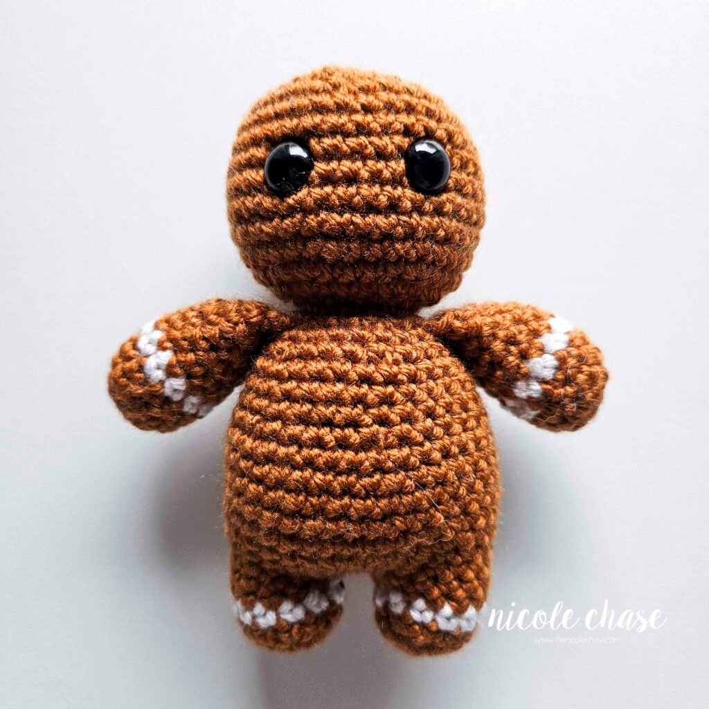 Free crochet gingerbread man pattern after the head has been completed. 