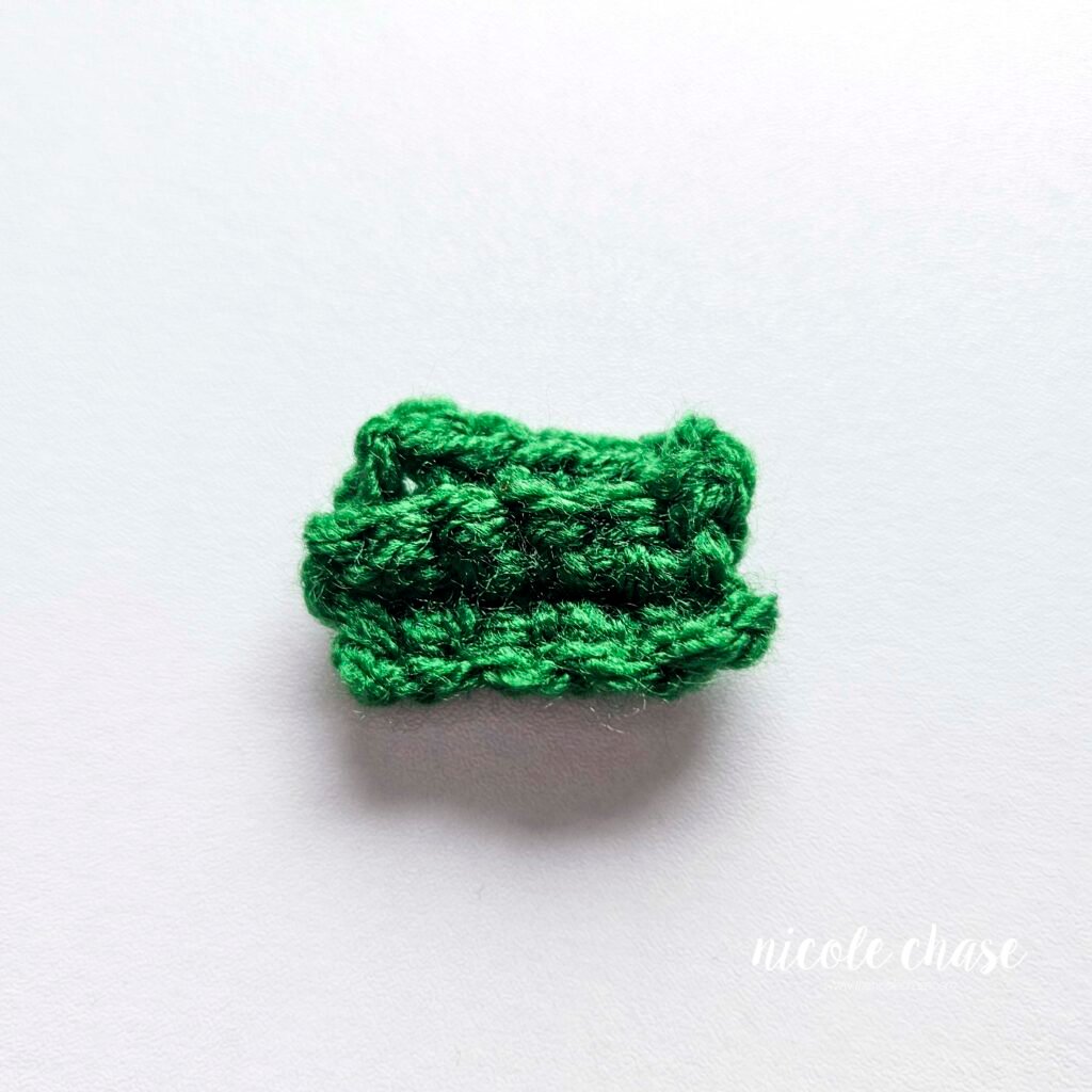 The rectangle of stitches for the bow of the gingerbread with the ends weaved in. 