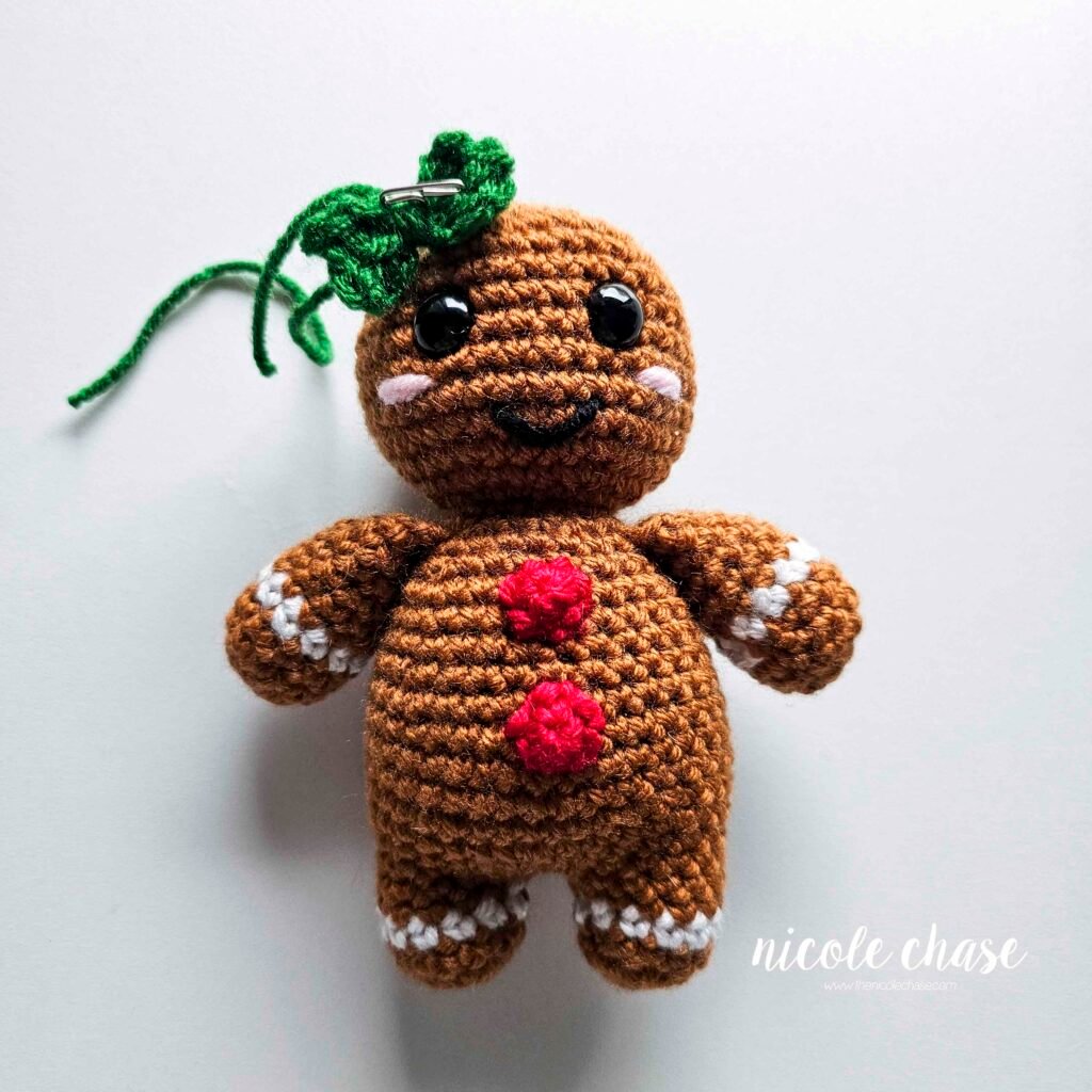 Tutorial image demonstrating the placement of the bow to be a hair bow  on the top left of the head, for a more feminine gingerbread. 