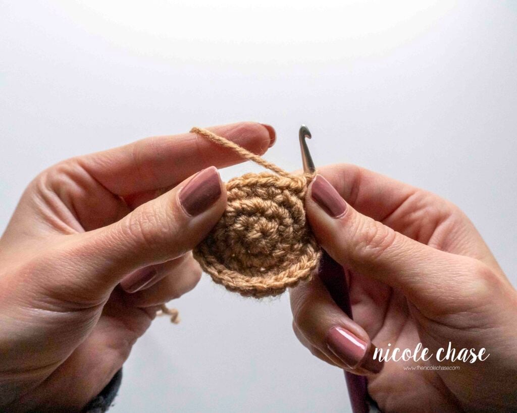 Image demonstrating how to flip the amigurumi piece so that the right side is on the exterior.