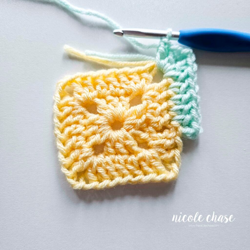 R3 of crocheting the blanket portion of the lion lovey crochet pattern in a mint color, part 3.