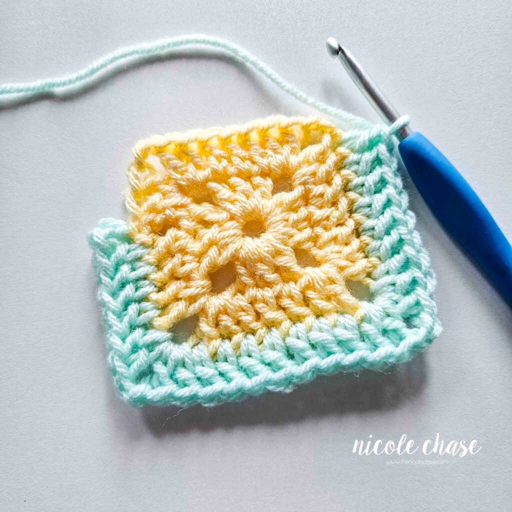 R3 of crocheting the blanket portion of the lion lovey crochet pattern in a mint color, part 6.
