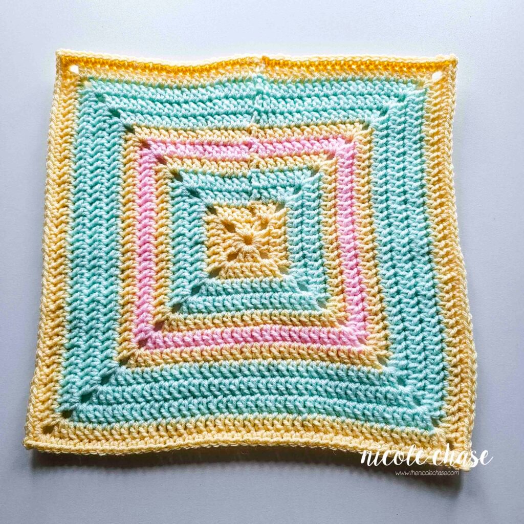 The finished blanket for the free lion lovey crochet pattern.