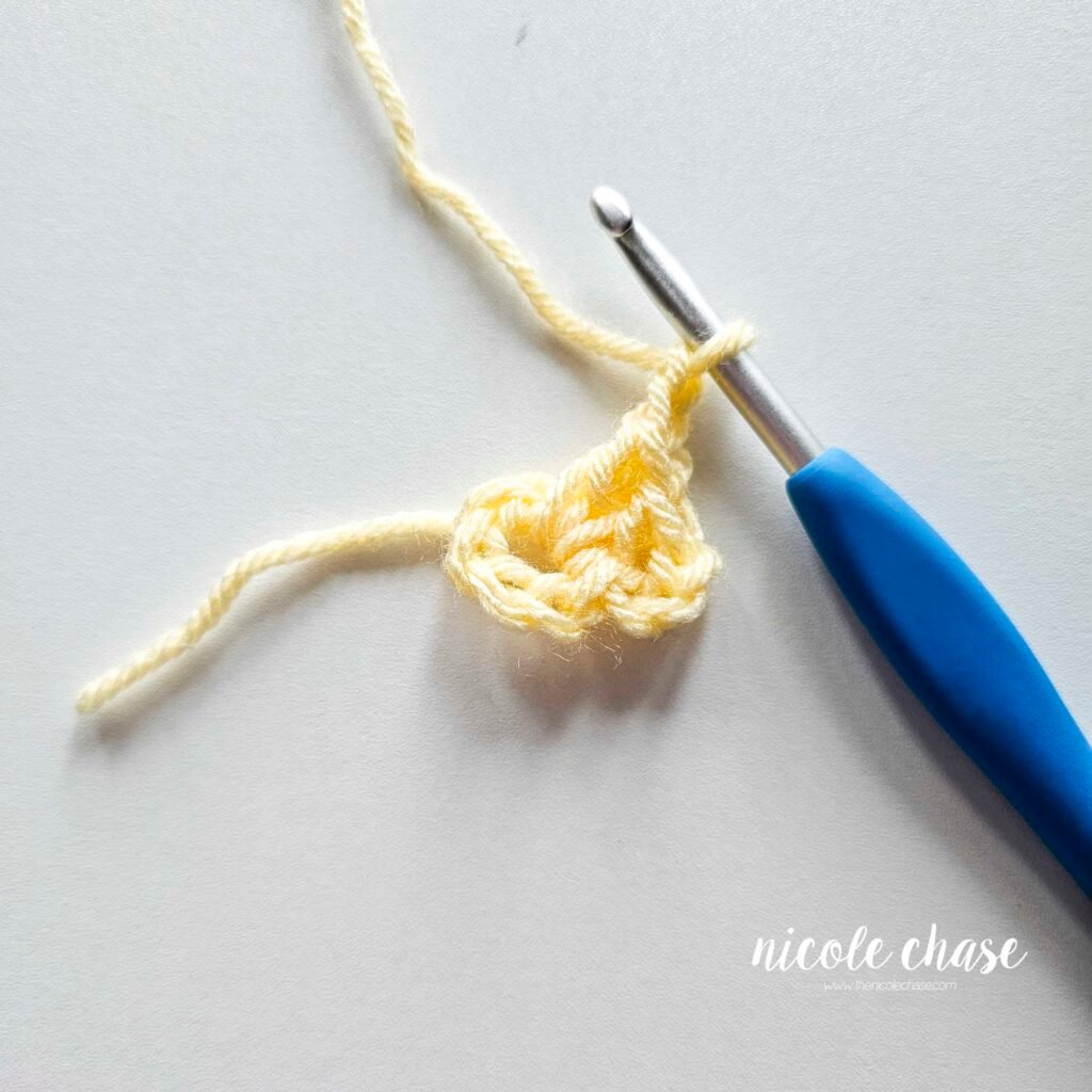 R1 of crocheting the blanket portion of the lion lovey crochet pattern, part 5.