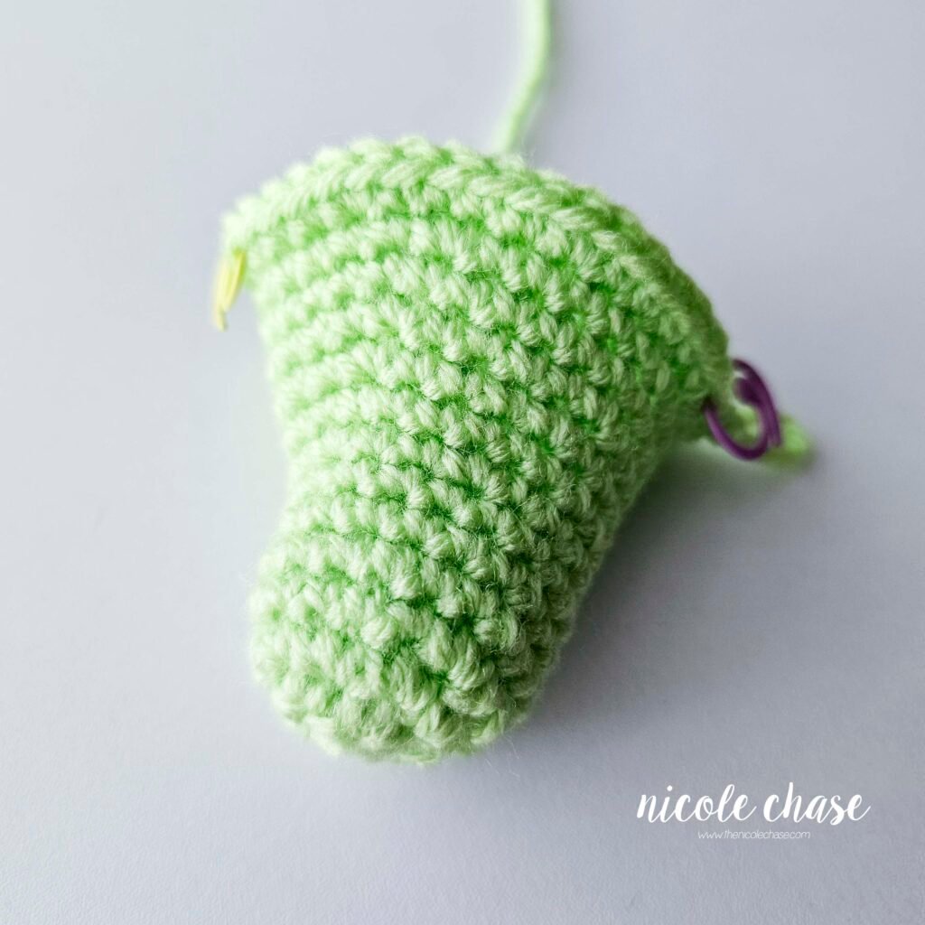 The head of the crochet alligator prior to adding the safety eyes.