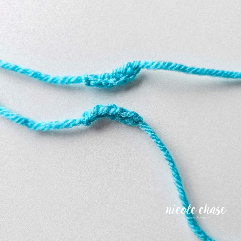 Two bright blue nostril pieces awaiting assembly.