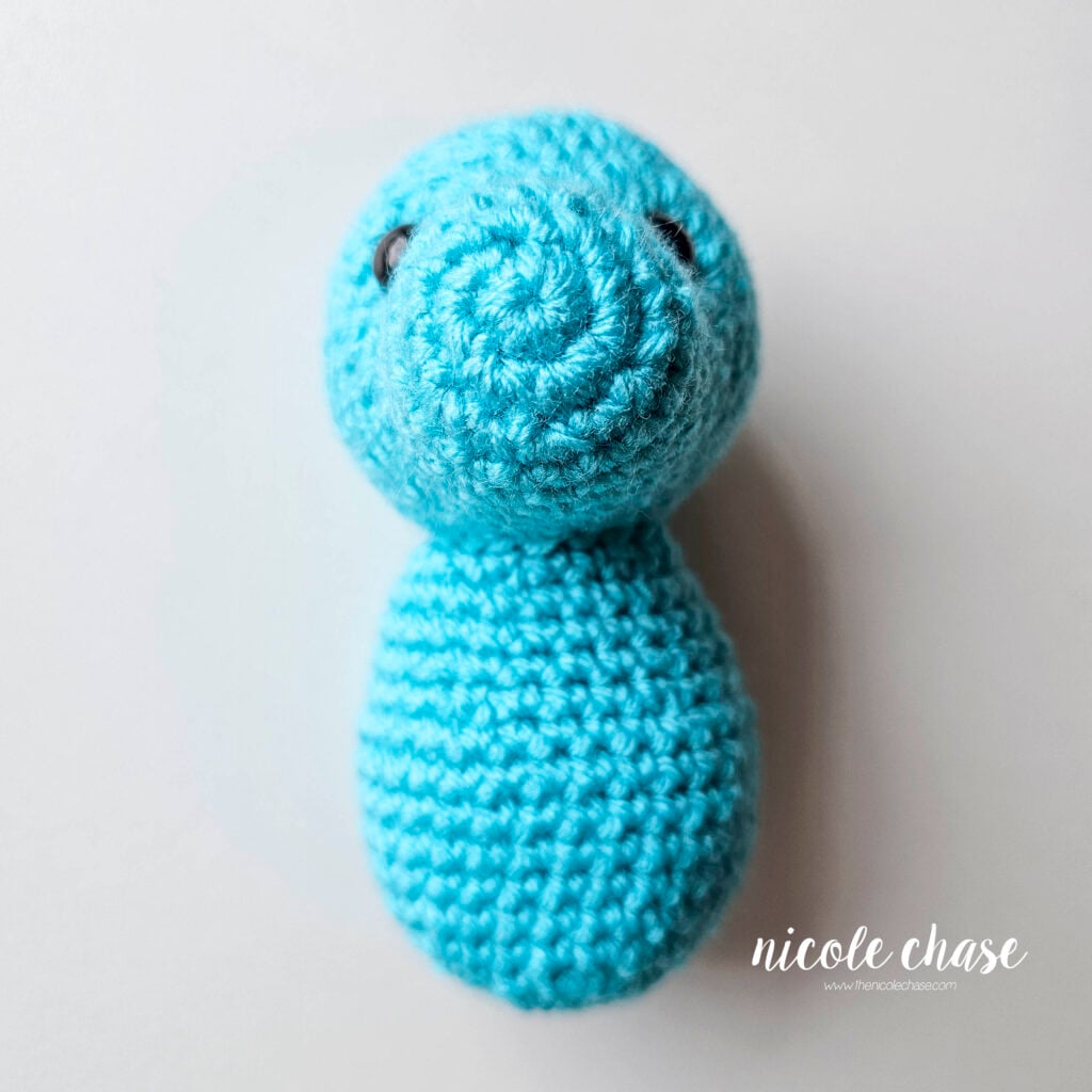 The body and the head have been sewn together, front view.