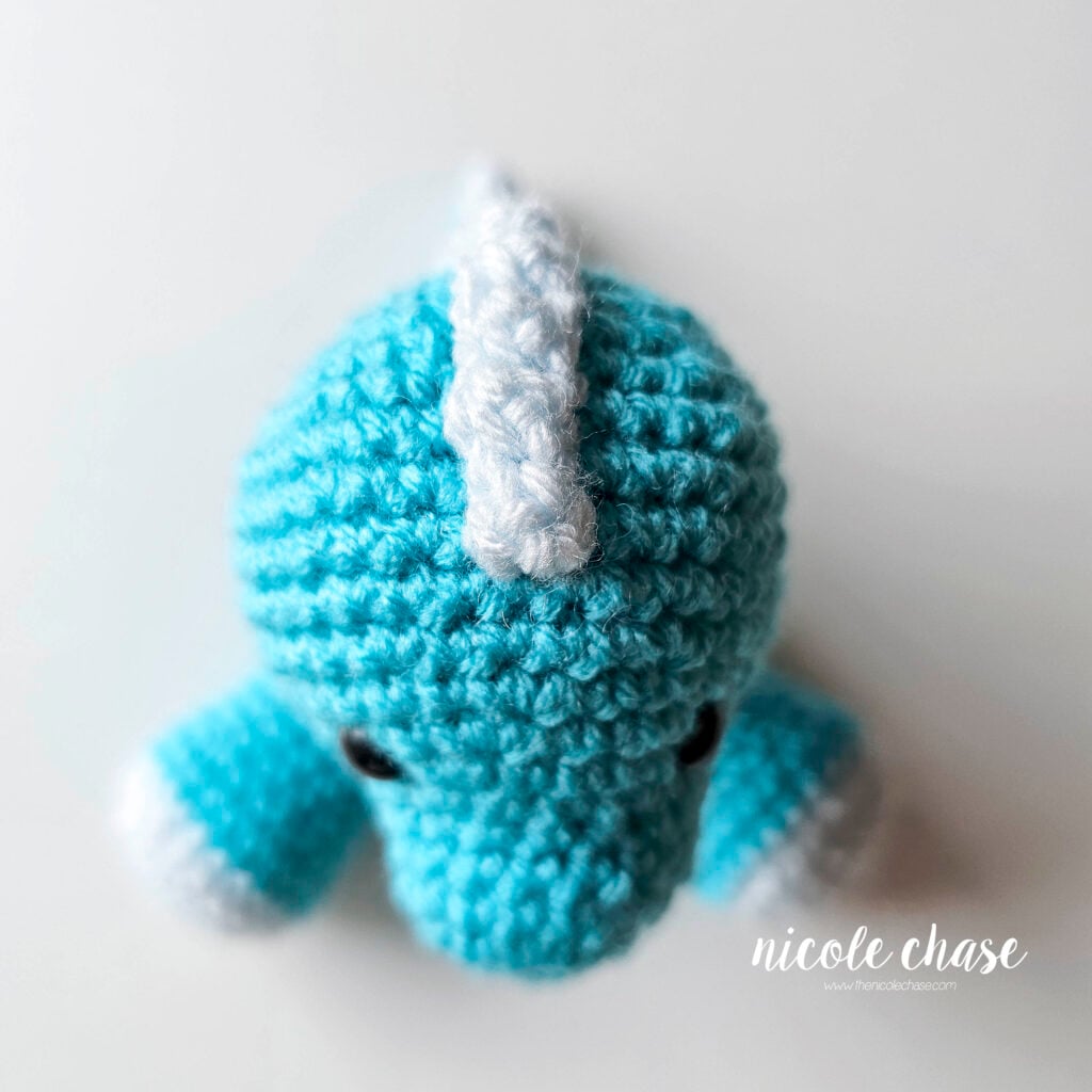 The light blue ridge piece has been sewn into place on the back of the dragon. This is a top down view of the ridge on the top of the head.