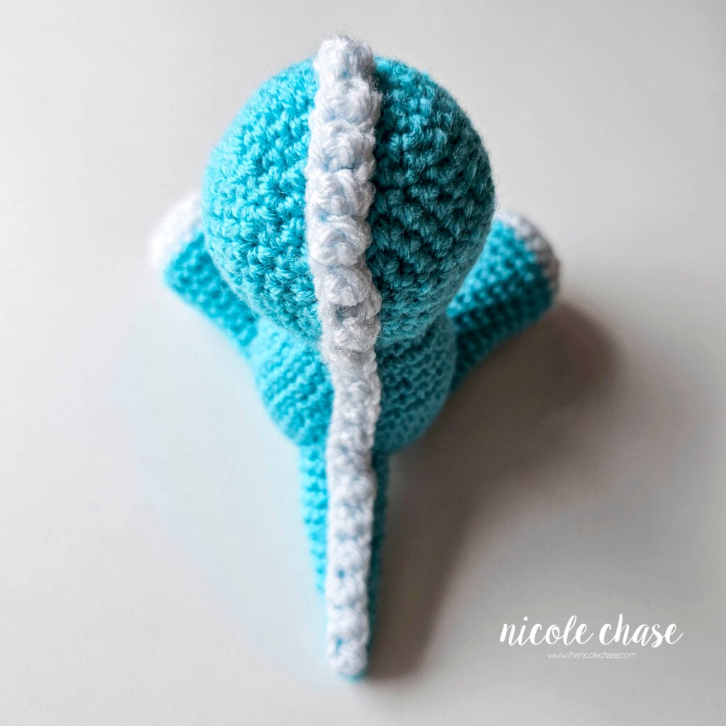 Another top down view of the entire ridge going down the head, body, and tail of the crochet dragon.