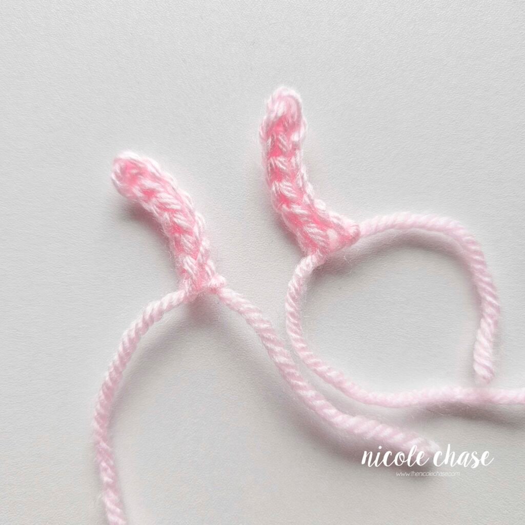 Two pink crochet antennas for the amigurumi snail.