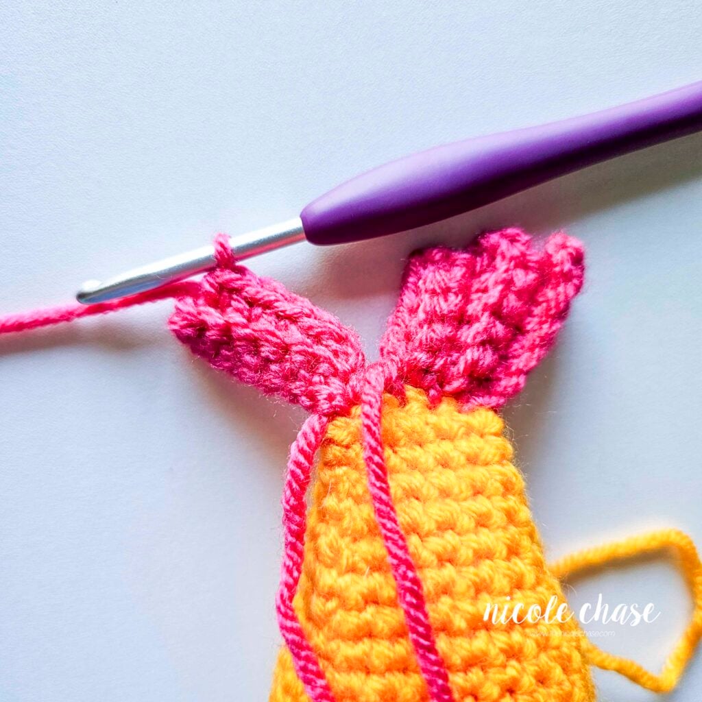 The single crochet stitches of the crochet fish's tail fin for R2.