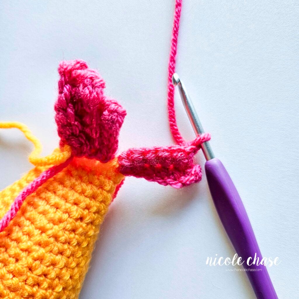 The start of R3 with a chain 1 of the crochet fish's tail fin.